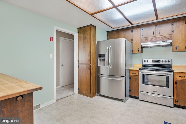 23359 Patuxent View Rd, Lexington Park, MD 20653 - kitchen with appliances with stainless steel finishes, under cabinet range hood, light floors, and baseboards