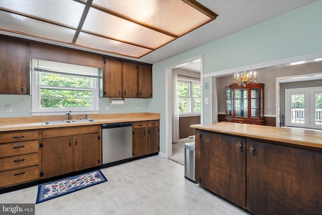 23359 Patuxent View Rd, Lexington Park, MD 20653 - kitchen featuring stainless steel dishwasher, a sink, light floors, and plenty of natural light