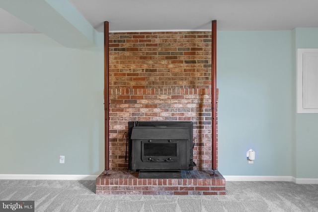 23359 Patuxent View Rd, Lexington Park, MD 20653 - detailed view of carpet flooring, baseboards, and a brick fireplace