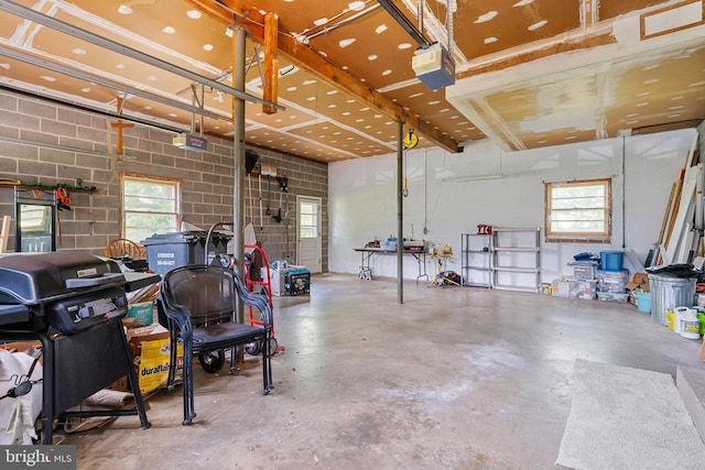 23359 Patuxent View Rd, Lexington Park, MD 20653 - garage featuring a garage door opener and concrete block wall