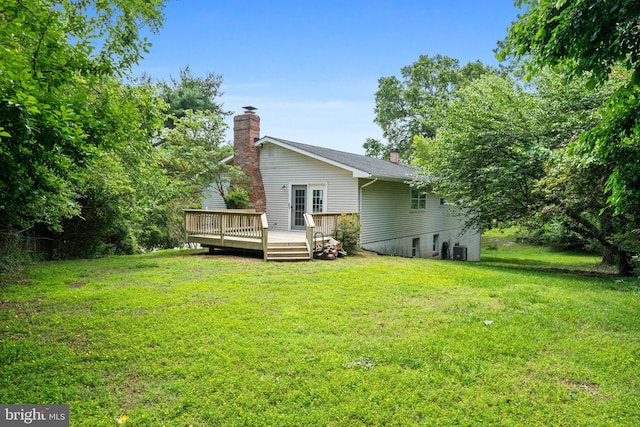 23359 Patuxent View Rd, Lexington Park, MD 20653 - back of property with a chimney, a wooden deck, and a lawn