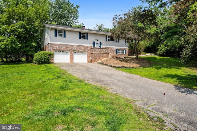 23359 Patuxent View Rd, Lexington Park, MD 20653 - raised ranch with asphalt driveway, a garage, a front lawn, and a chimney