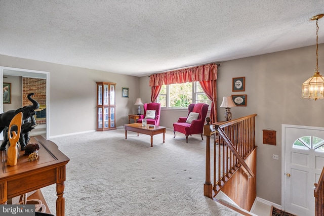 23359 Patuxent View Rd, Lexington Park, MD 20653 - carpeted living room with a textured ceiling, a chandelier, and baseboards