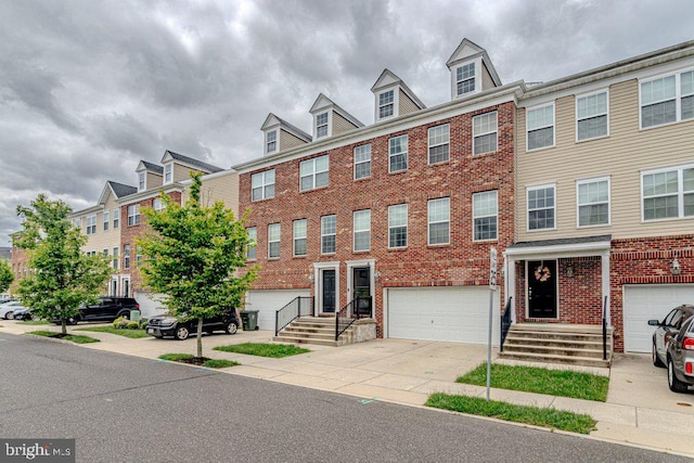 109 Riverwalk Blvd, Burlington, NJ 08016 - multi unit property featuring an attached garage, brick siding, and driveway