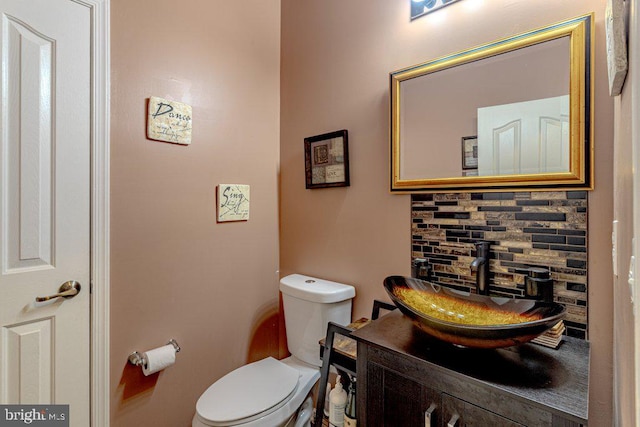 109 Riverwalk Blvd, Burlington, NJ 08016 - half bathroom featuring vanity, toilet, and decorative backsplash