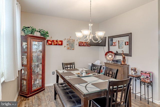 109 Riverwalk Blvd, Burlington, NJ 08016 - dining room featuring a chandelier, wood finished floors, and baseboards