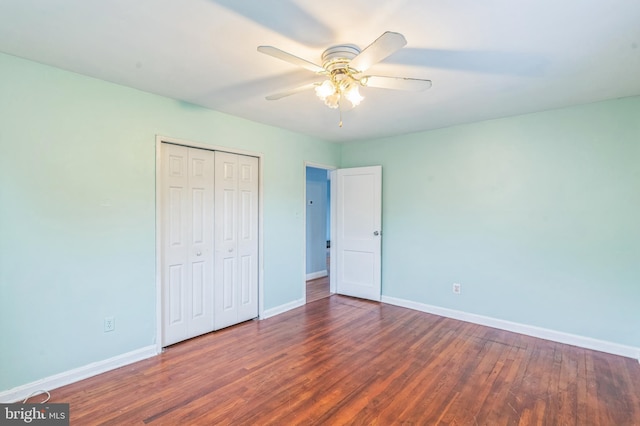 224 University Blvd E, Silver Spring, MD 20901 - unfurnished bedroom featuring baseboards, wood finished floors, and a closet