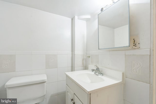 224 University Blvd E, Silver Spring, MD 20901 - bathroom with tile walls, vanity, and toilet