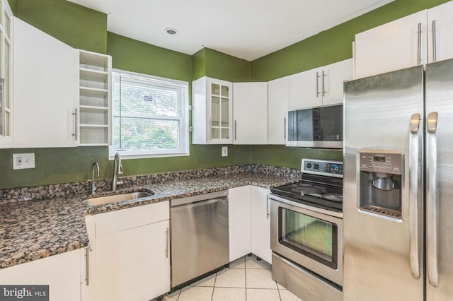 224 University Blvd E, Silver Spring, MD 20901 - kitchen with appliances with stainless steel finishes, a sink, white cabinetry, backsplash, and glass insert cabinets