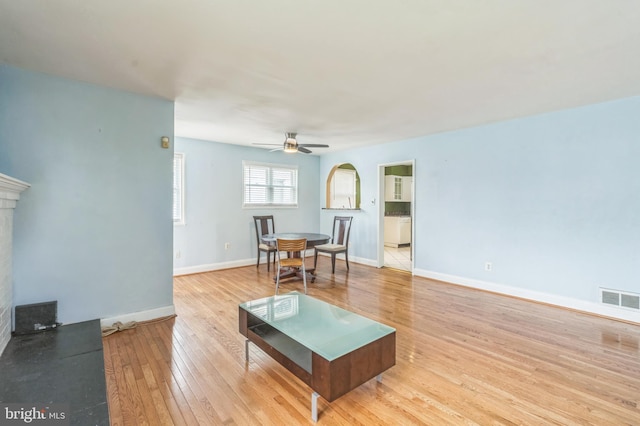 224 University Blvd E, Silver Spring, MD 20901 - living room with hardwood / wood-style floors, baseboards, ceiling fan, and a fireplace