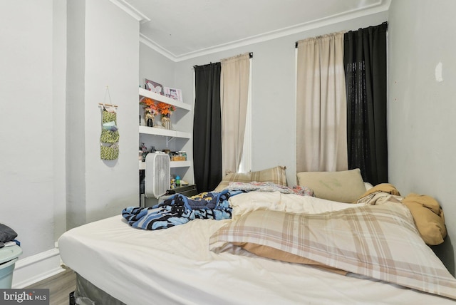 3125 N 7th St, Philadelphia, PA 19133 - bedroom with ornamental molding, wood finished floors, and baseboards