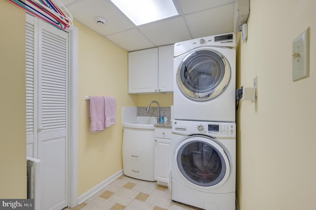 680 Mara Rose Ln, Harpers Ferry, WV 25425 - laundry area with stacked washer and clothes dryer, cabinet space, and baseboards