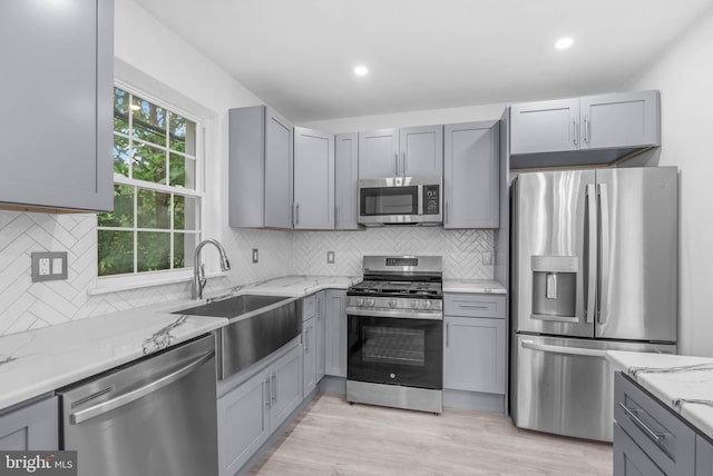 10 W Pomona St, Philadelphia, PA 19144 - kitchen with stainless steel appliances, gray cabinets, a sink, light stone countertops, and recessed lighting