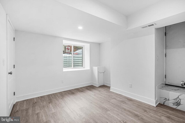 10 W Pomona St, Philadelphia, PA 19144 - unfurnished bedroom with wood finished floors, baseboards, and recessed lighting