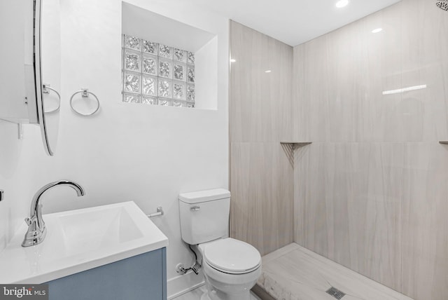 10 W Pomona St, Philadelphia, PA 19144 - bathroom featuring toilet, vanity, and a tile shower