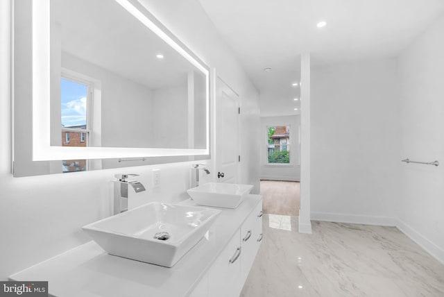 10 W Pomona St, Philadelphia, PA 19144 - bathroom featuring double vanity, marble finish flooring, baseboards, and recessed lighting