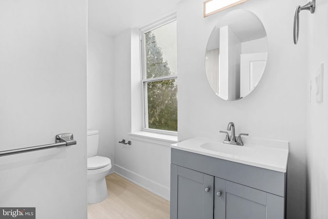 10 W Pomona St, Philadelphia, PA 19144 - bathroom featuring toilet, baseboards, vanity, and plenty of natural light