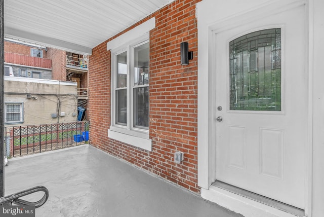 10 W Pomona St, Philadelphia, PA 19144 - doorway to property featuring a porch and brick siding