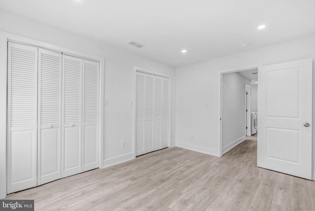 10 W Pomona St, Philadelphia, PA 19144 - unfurnished bedroom featuring light wood-type flooring, multiple closets, baseboards, recessed lighting, and washer and clothes dryer