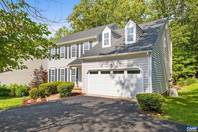 1902 English Oaks Cir N, Charlottesville, VA 22911 - colonial inspired home with an attached garage, asphalt driveway, central air condition unit, roof with shingles, and a front yard