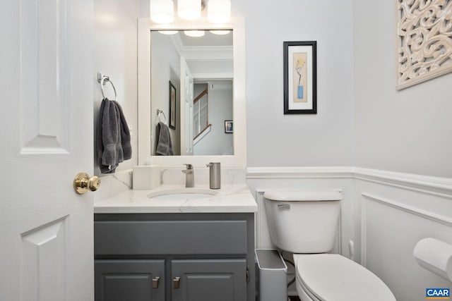 1902 English Oaks Cir N, Charlottesville, VA 22911 - half bathroom featuring crown molding, vanity, toilet, and wainscoting