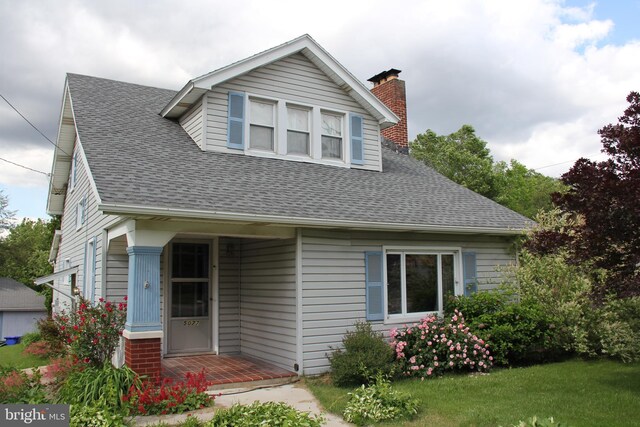 5077 Lincoln Hwy W, Thomasville, PA 17364 - bungalow-style house featuring a chimney and a shingled roof