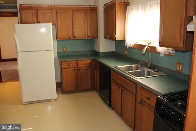5077 Lincoln Hwy W, Thomasville, PA 17364 - kitchen with black appliances, a sink, and brown cabinetry