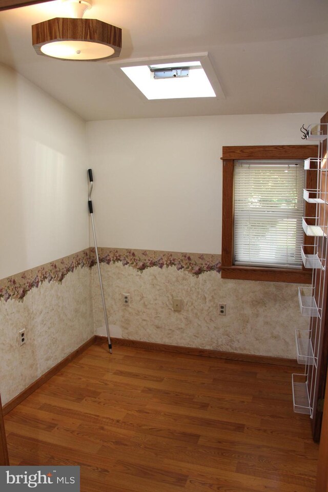 5077 Lincoln Hwy W, Thomasville, PA 17364 - spare room with wood finished floors, a wainscoted wall, and wallpapered walls