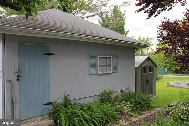 5077 Lincoln Hwy W, Thomasville, PA 17364 - view of home's exterior featuring a lawn and a shingled roof