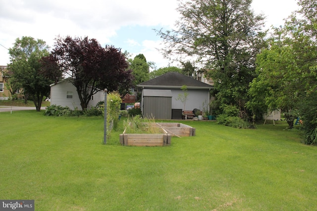 5077 Lincoln Hwy W, Thomasville, PA 17364 - view of grassy yard with a garden and an outbuilding