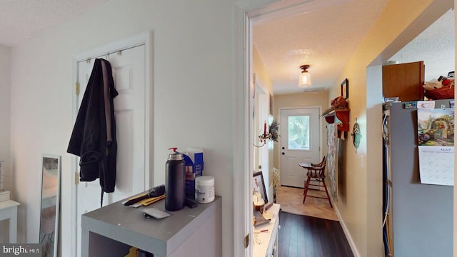 240 Dogwood Dr, Romney, WV 26757 - hallway with a textured ceiling, dark wood-style floors, and baseboards