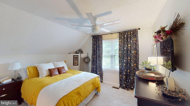 240 Dogwood Dr, Romney, WV 26757 - bedroom with vaulted ceiling, light colored carpet, a textured ceiling, ceiling fan, and baseboards