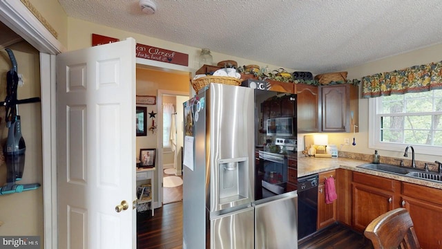 240 Dogwood Dr, Romney, WV 26757 - kitchen with a sink, appliances with stainless steel finishes, dark wood-type flooring, light countertops, and a textured ceiling