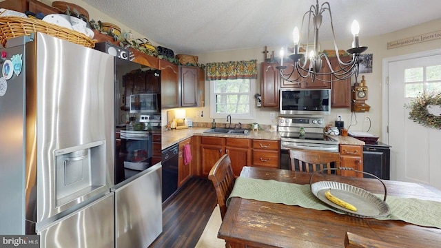 240 Dogwood Dr, Romney, WV 26757 - kitchen featuring appliances with stainless steel finishes, a sink, a chandelier, dark wood-style flooring, and light countertops