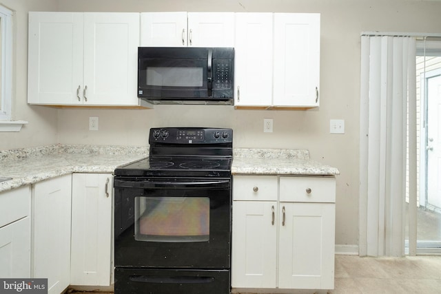 4 Corvas Ct, Sewell, NJ 08080 - kitchen featuring black appliances, white cabinets, baseboards, and light stone counters