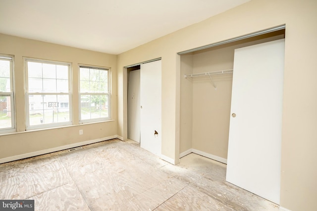 4 Corvas Ct, Sewell, NJ 08080 - unfurnished bedroom featuring two closets and baseboards