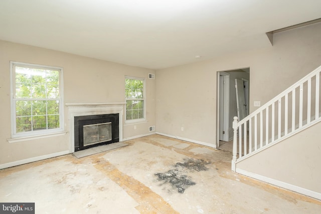 4 Corvas Ct, Sewell, NJ 08080 - unfurnished living room with baseboards, a fireplace, and stairway