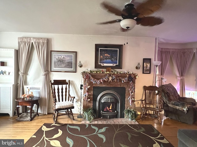 460 Baltimore St, Gettysburg, PA 17325 - sitting room featuring ceiling fan, wood finished floors, and a lit fireplace