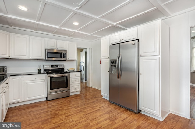 7536 Marks Ave, Nottingham, MD 21236 - kitchen with stainless steel appliances, light wood finished floors, white cabinets, recessed lighting, and dark countertops