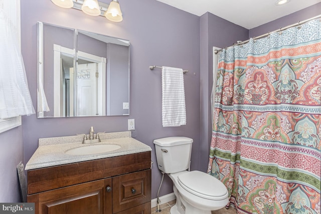 7536 Marks Ave, Nottingham, MD 21236 - bathroom featuring vanity, toilet, baseboards, and a shower with shower curtain