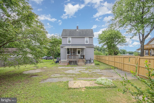 7536 Marks Ave, Nottingham, MD 21236 - rear view of property with covered porch and a chimney