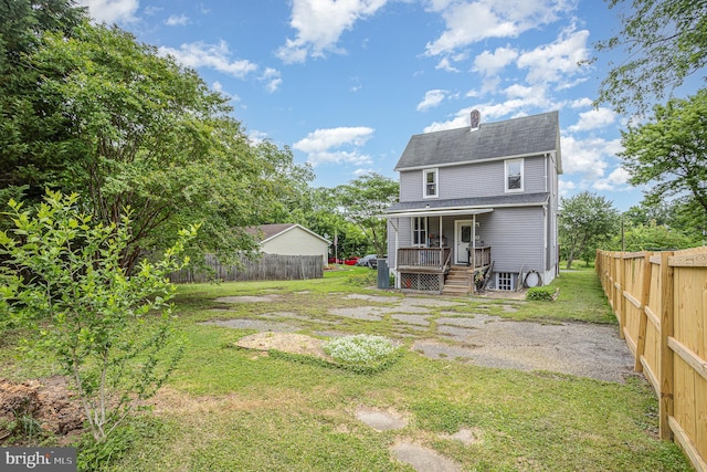 7536 Marks Ave, Nottingham, MD 21236 - back of house with roof with shingles, a chimney, and covered porch