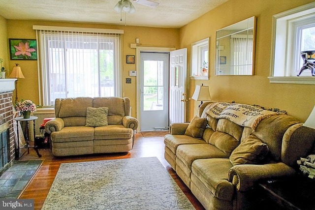 410 Beechwood Ave, Trenton, NJ 08618 - living area featuring a fireplace, a ceiling fan, wood finished floors, and a textured ceiling