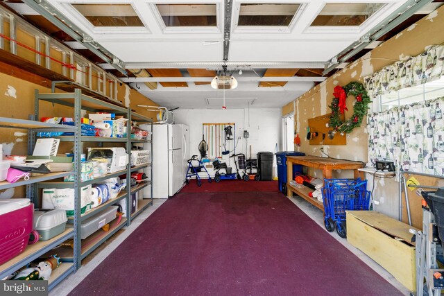 29 Sheffield Pl, Southampton, NJ 08088 - garage with freestanding refrigerator, a garage door opener, and a workshop area