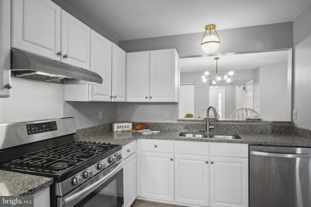 204 Fawn Rdg N, Harrisburg, PA 17110 - kitchen featuring appliances with stainless steel finishes, under cabinet range hood, a chandelier, and white cabinets