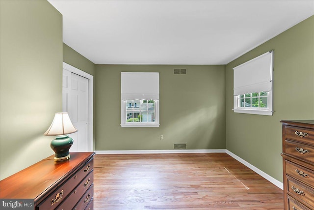 242 Pennwood St, Newark, DE 19713 - unfurnished bedroom featuring light wood-type flooring, baseboards, and a closet