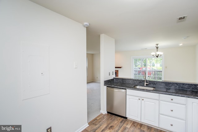 144 Carousel Cir, Doylestown, PA 18901 - kitchen with dishwasher, a sink, electric panel, white cabinets, and light wood-style floors