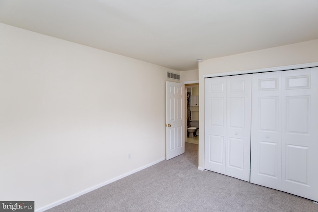144 Carousel Cir, Doylestown, PA 18901 - unfurnished bedroom featuring light carpet, baseboards, and a closet
