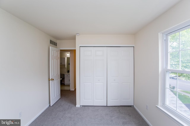 144 Carousel Cir, Doylestown, PA 18901 - unfurnished bedroom with carpet flooring, a closet, and baseboards