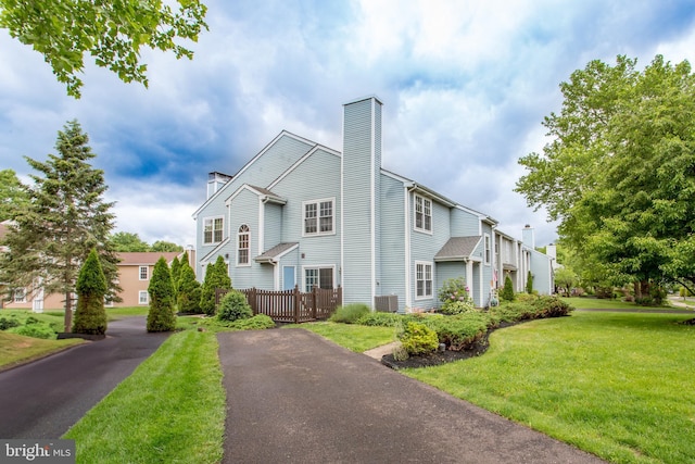 144 Carousel Cir, Doylestown, PA 18901 - view of front of house featuring a chimney and cooling unit